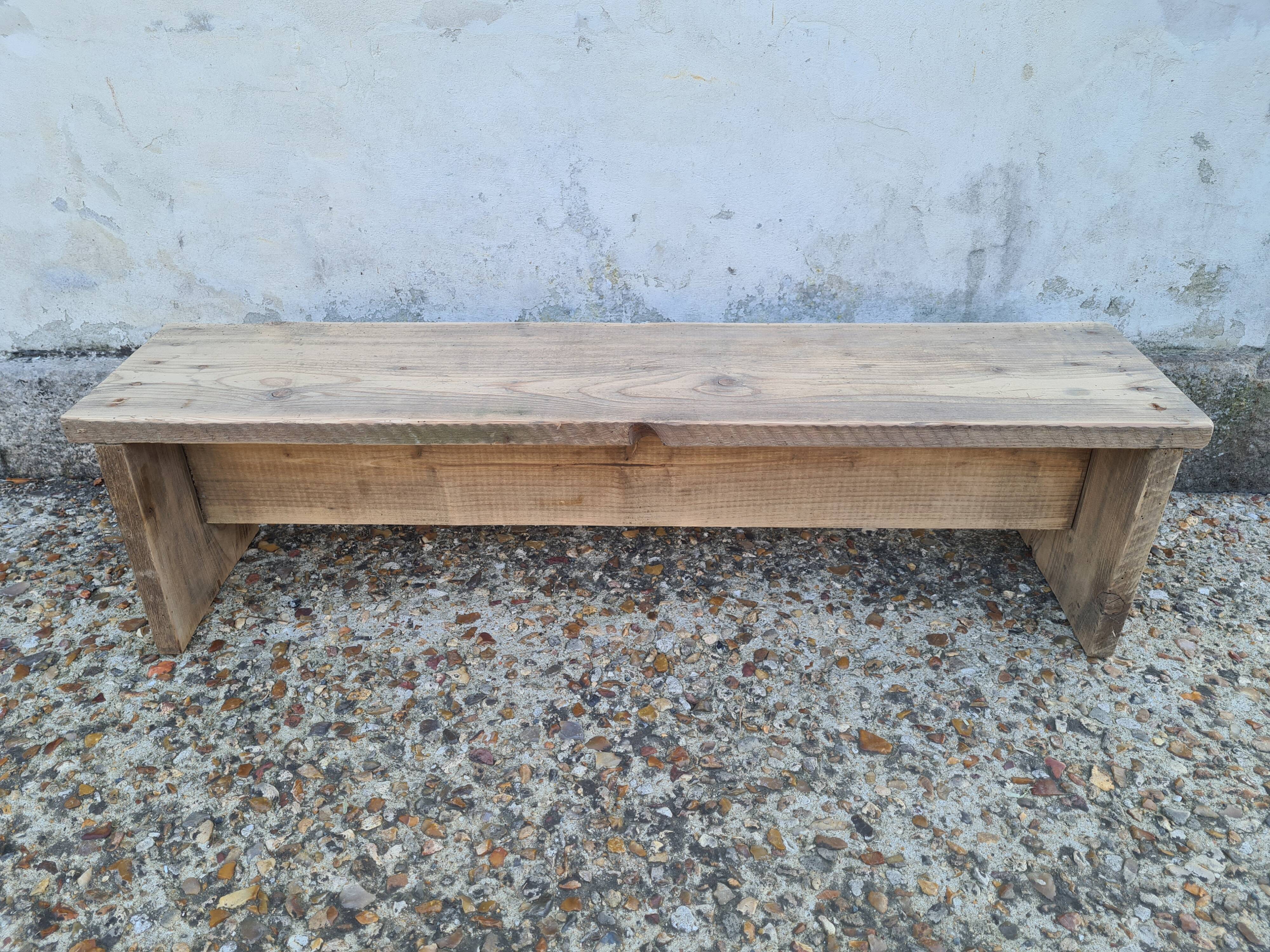 Small raw wood bench