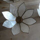 Brass chandelier and flowers in mother-of-pearl petals