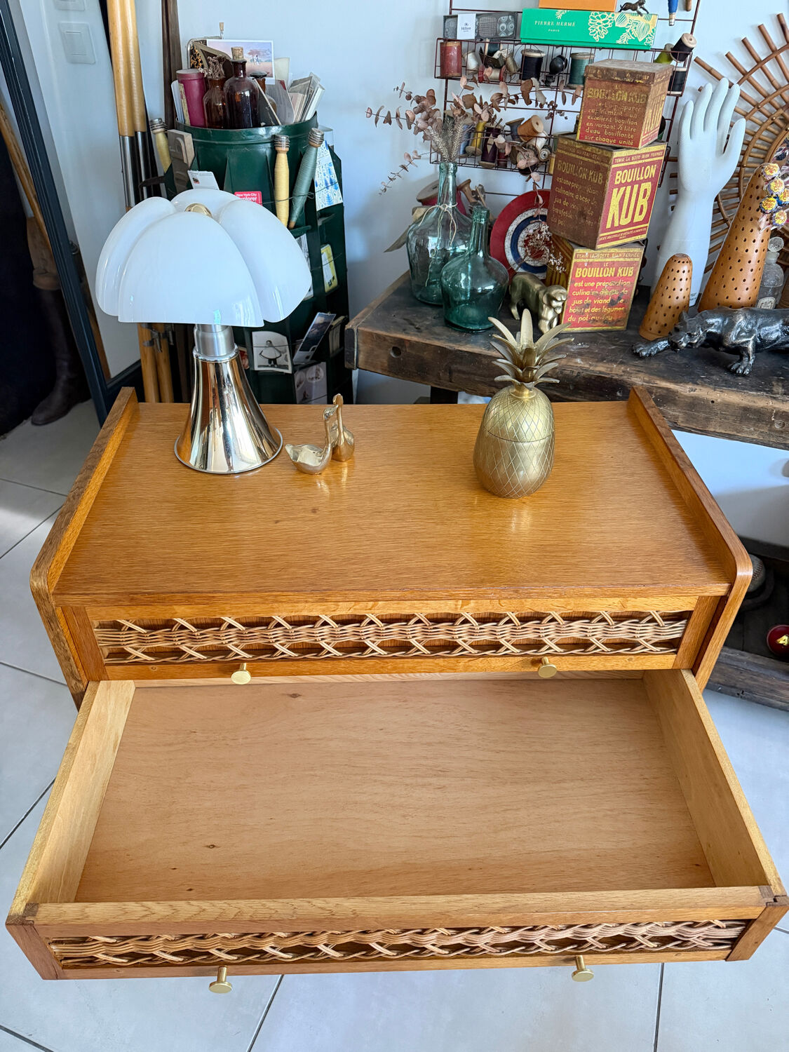 Vintage wooden and rattan chest of drawers with tapered legs.