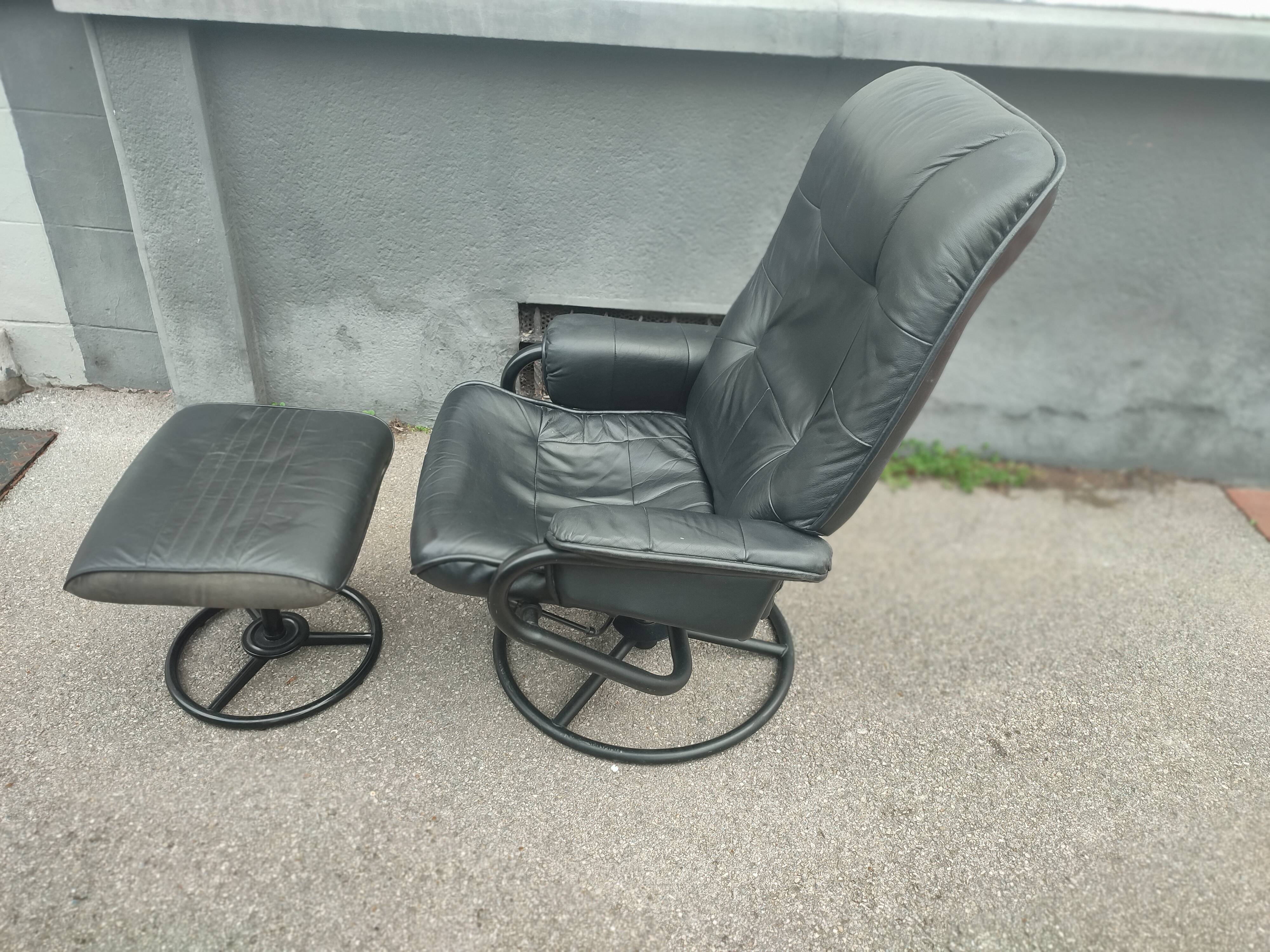 Scandinavian design leather armchair and footrest