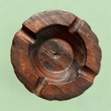 Old ashtray on carved wooden stand