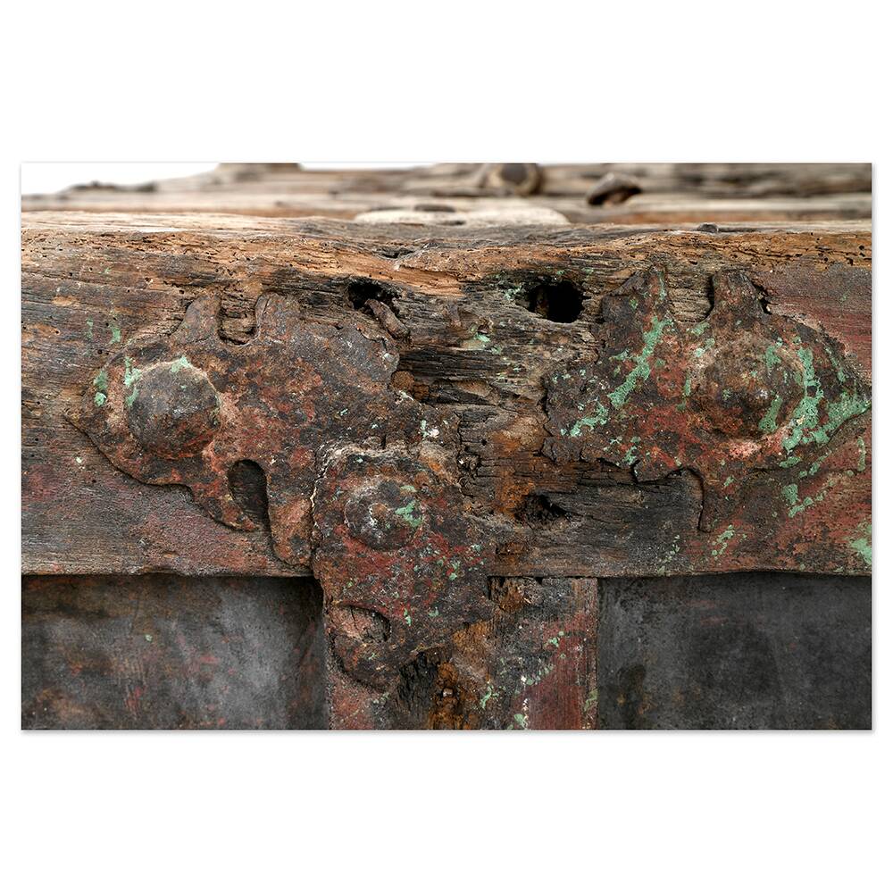 Large wooden and metal chest with red patina