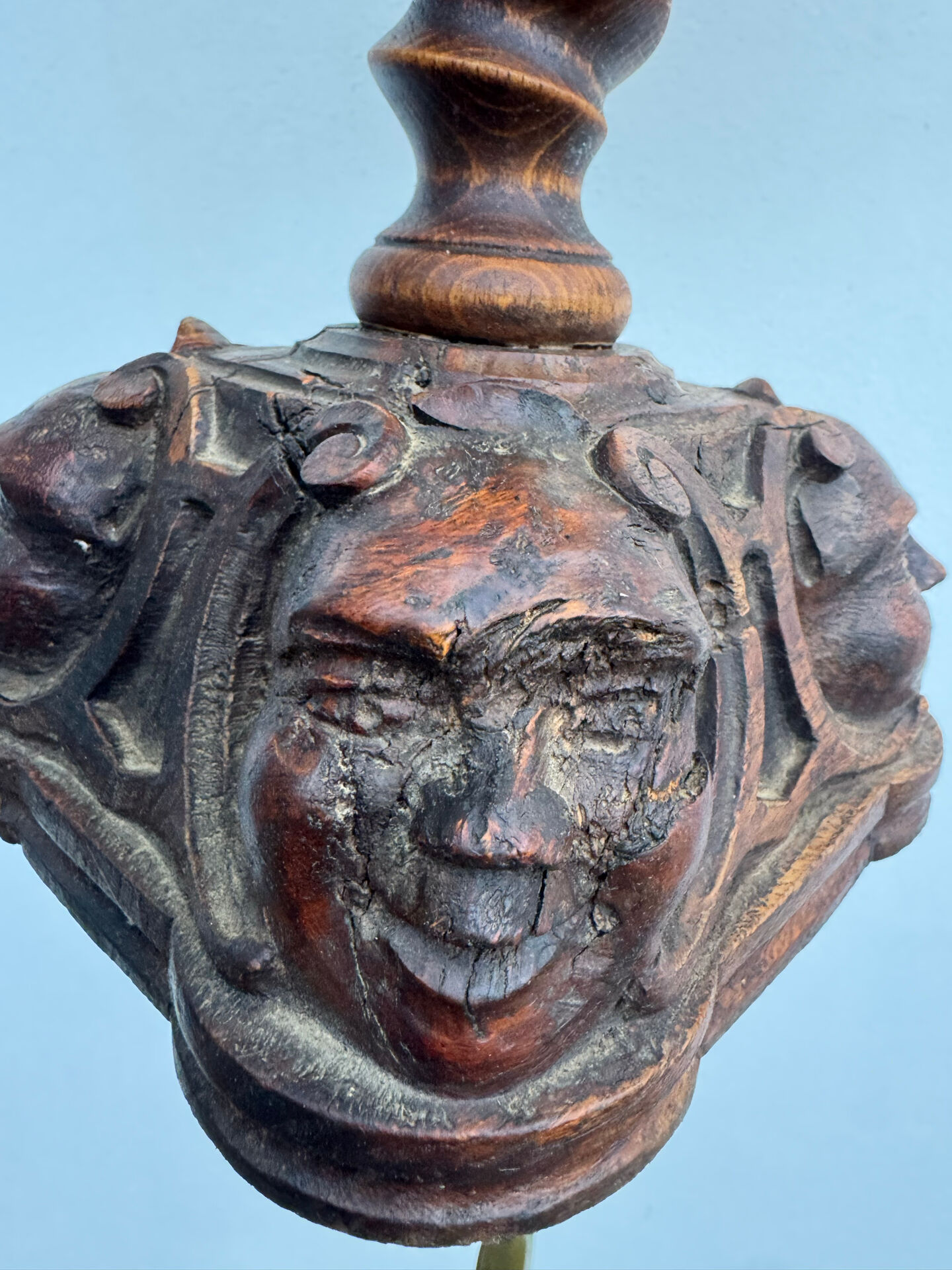 Sculpted wooden lamp with faces, antique.