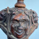 Sculpted wooden lamp with faces, antique.