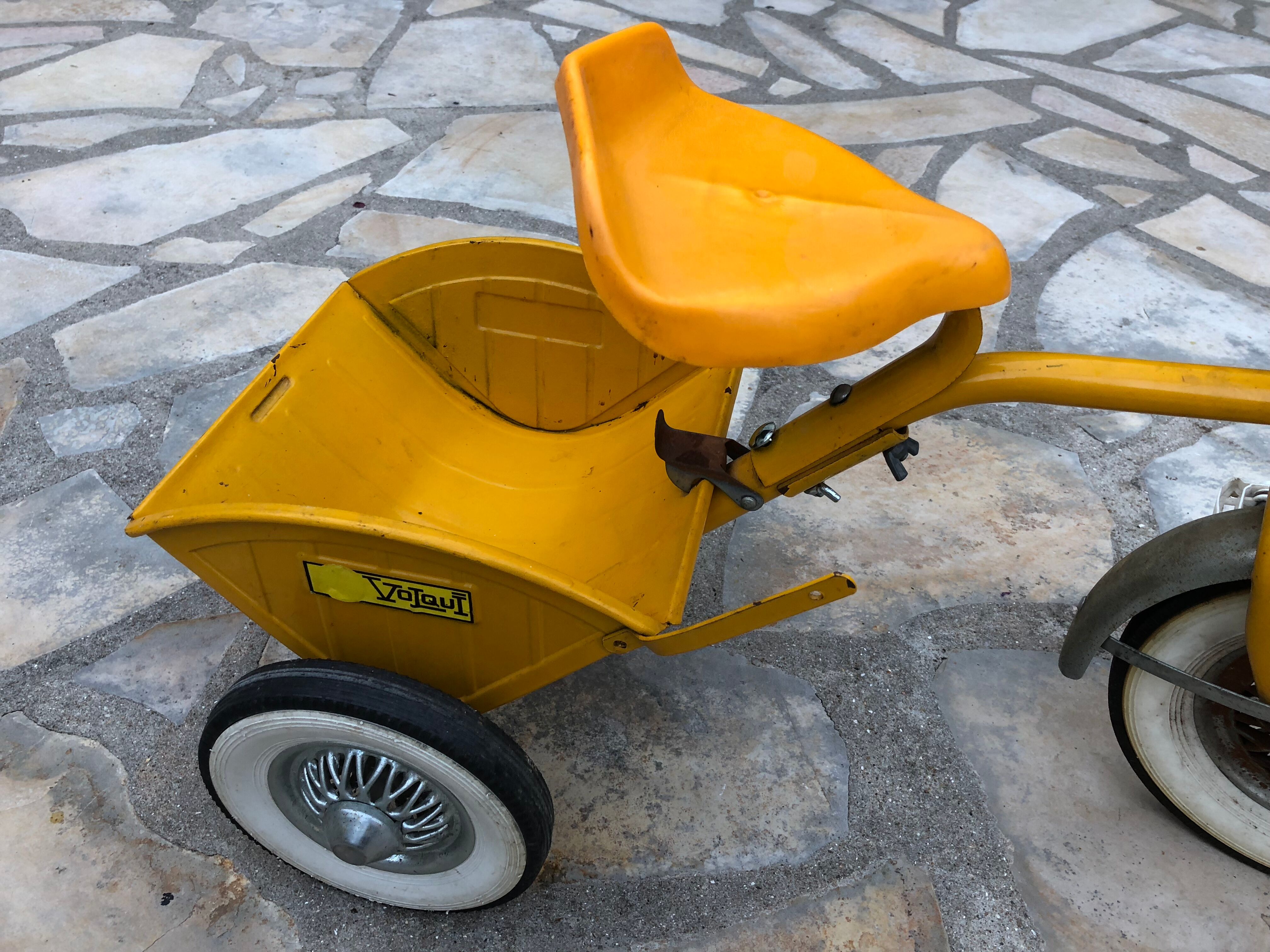 Yellow tricycle with folding bucket