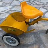 Yellow tricycle with folding bucket