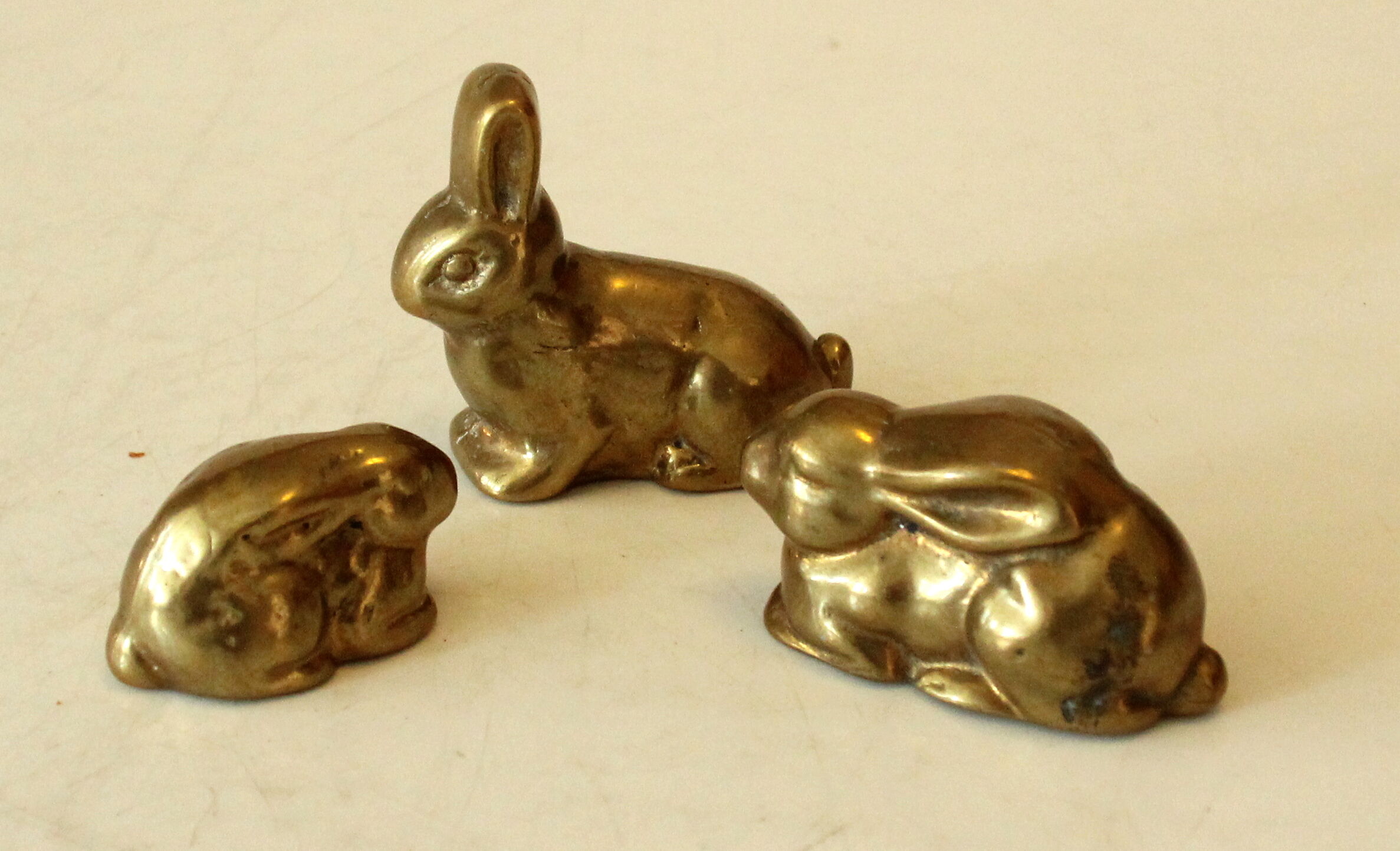 3 solid brass paperweights in the shape of rabbits vintage from the 1960s