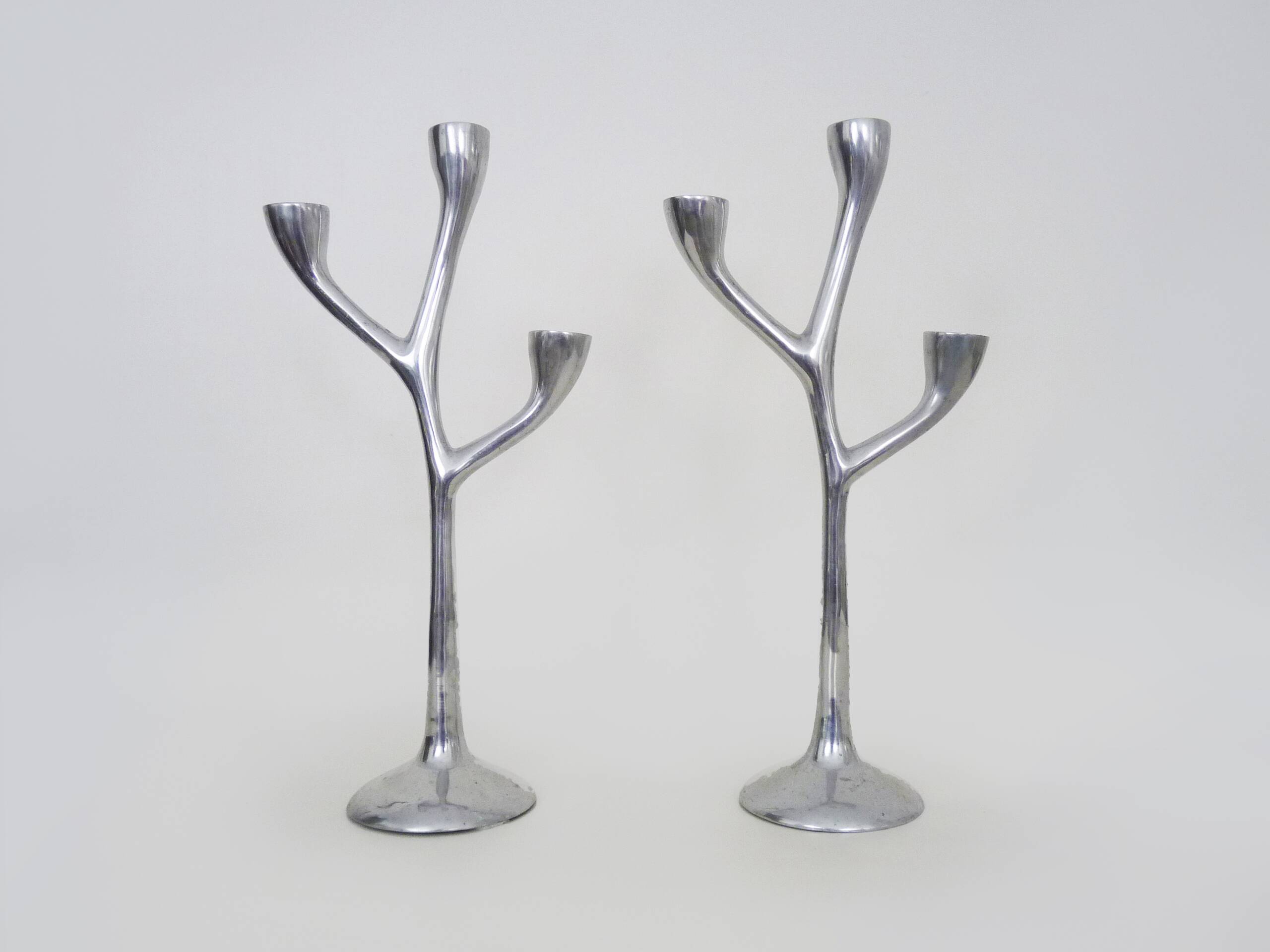 Pair of Italian "Tree" candlesticks in cast aluminum from the 80s