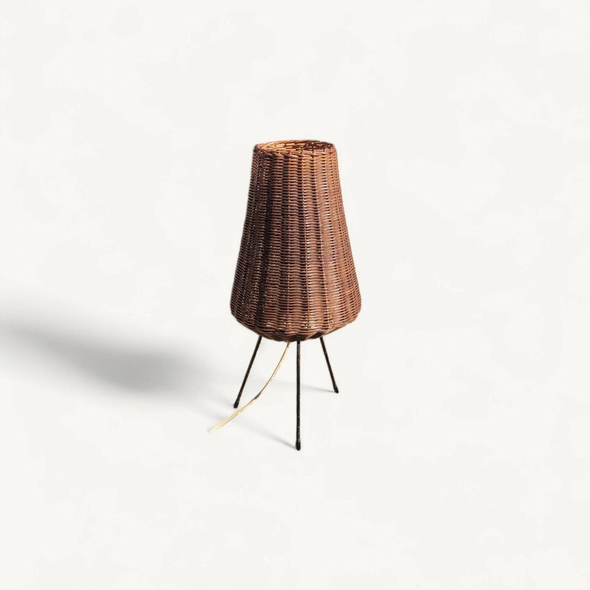 Tripod lamp and rattan from the 1950s.