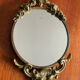 Antique small bronze mirror in Louis XIV style