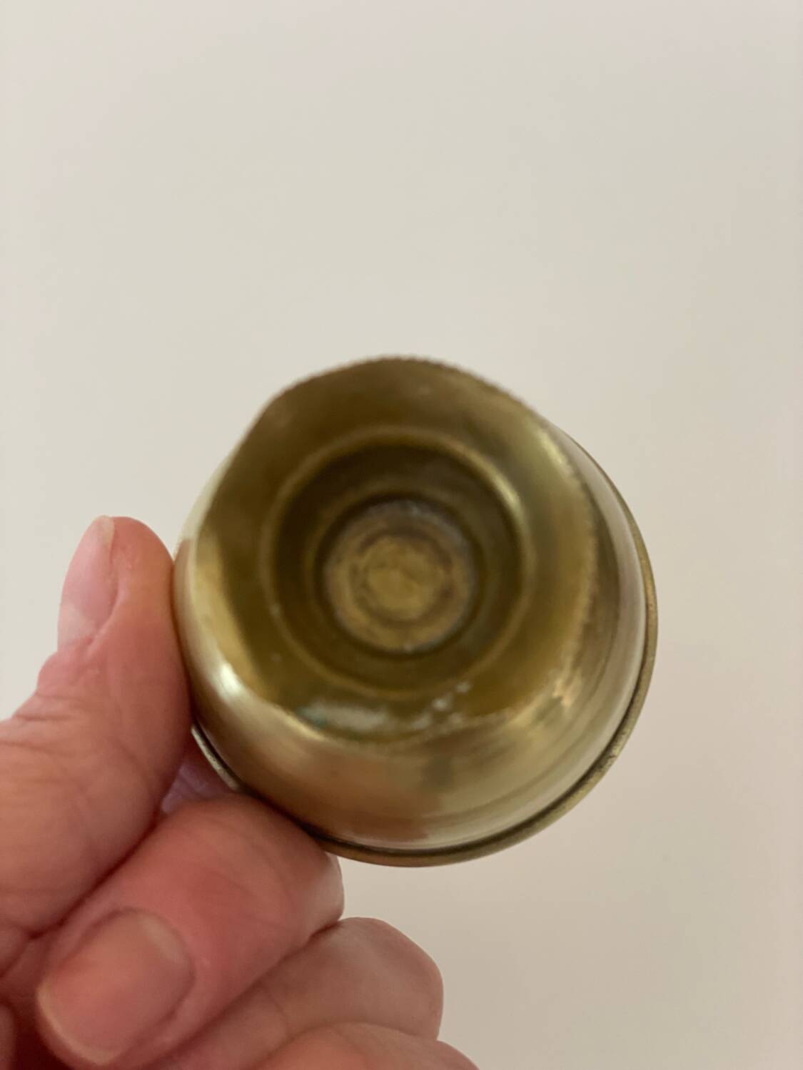 4 golden brass egg cups