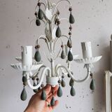 Antique white lacquered metal chandelier with wooden pendants.