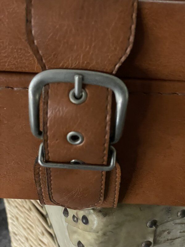 Antique suitcase with brown leather straps