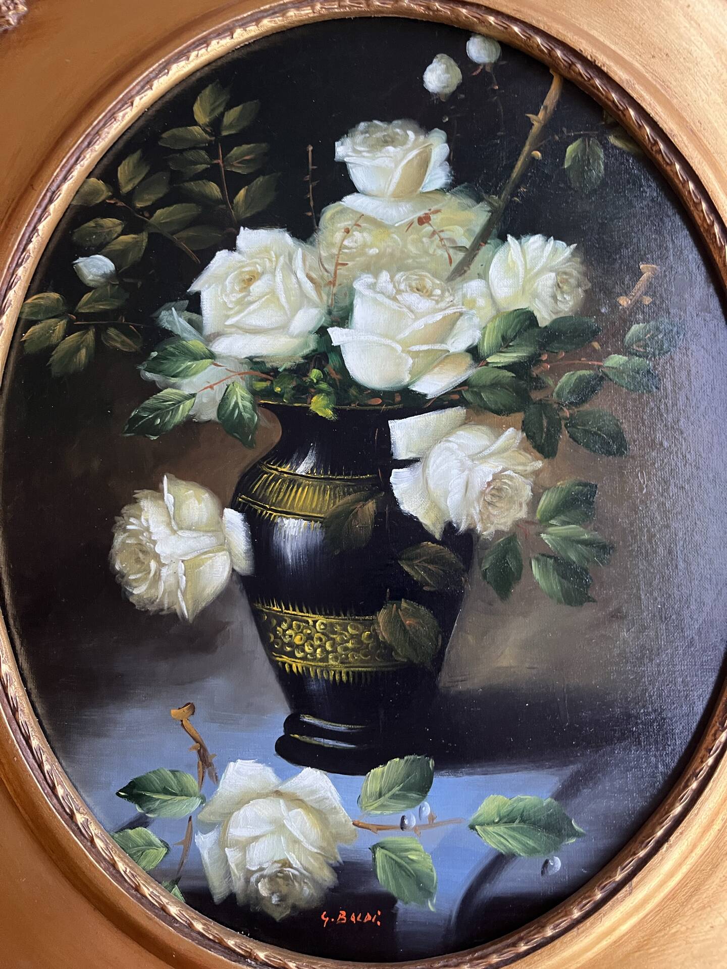 Large still life with white roses in an old gilded oval frame.