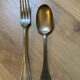 Two sets of silver-plated cutlery.