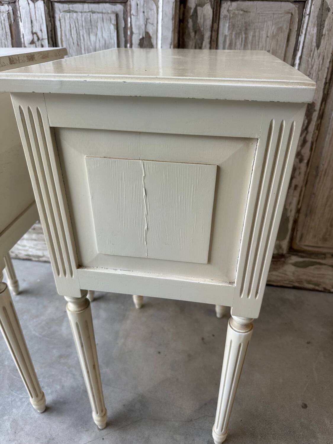 Pair of Louis XVI style bedside tables in white lacquered wood