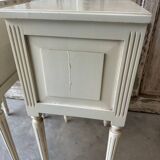 Pair of Louis XVI style bedside tables in white lacquered wood
