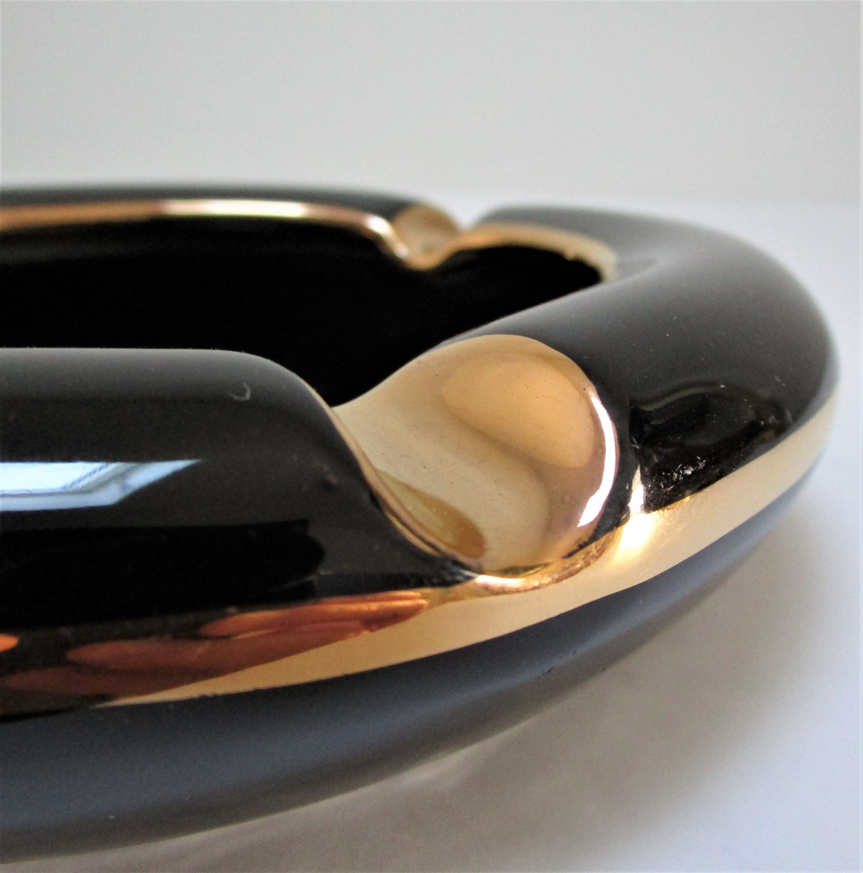 Black ceramic ashtray and vintage gold 50/60