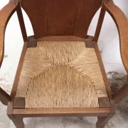 Pair of brutalist oak lounge chairs with rush seats – Netherlands