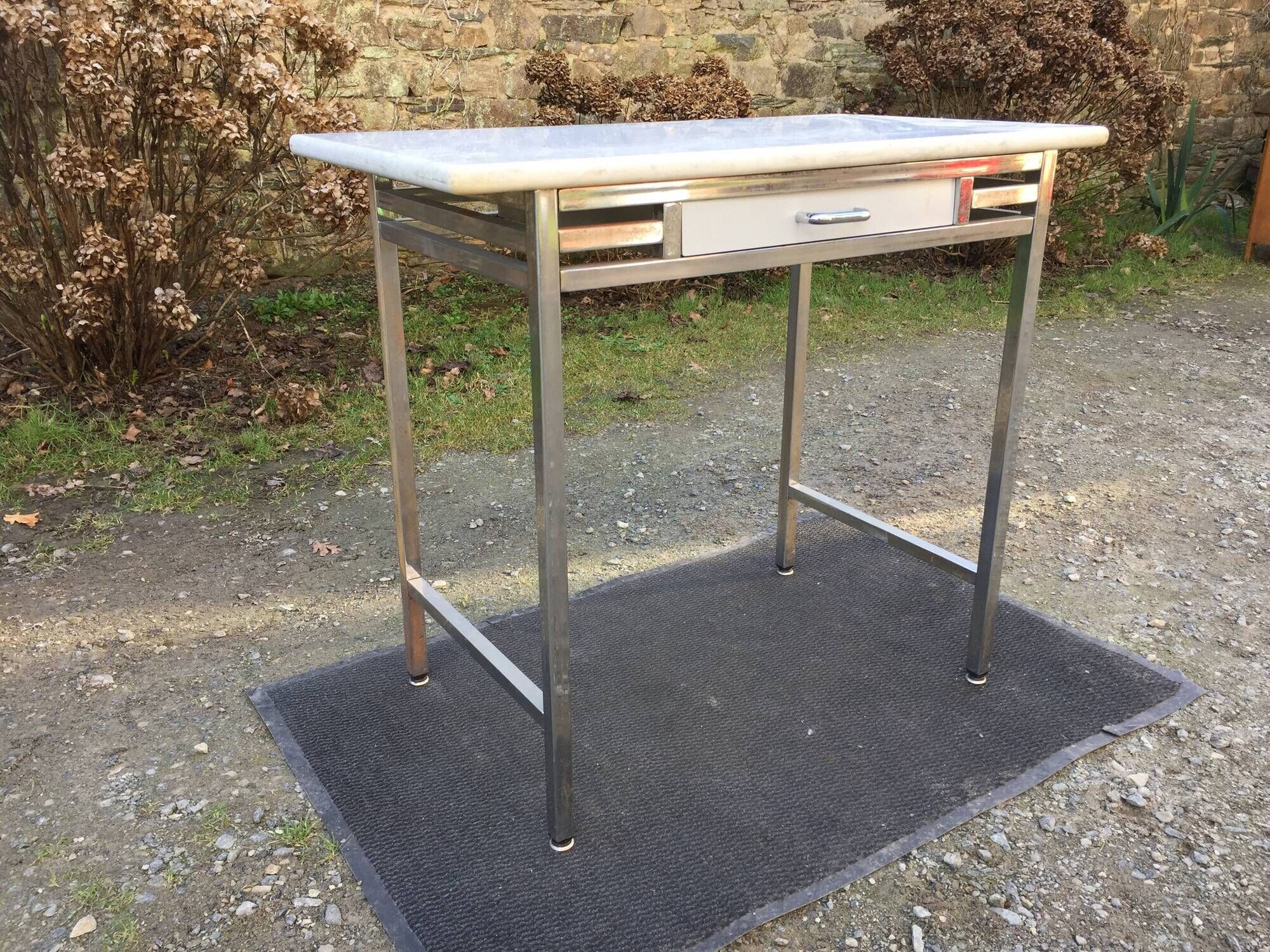 Vintage table with square chrome tubular metal base and marble top with 1 drawer.