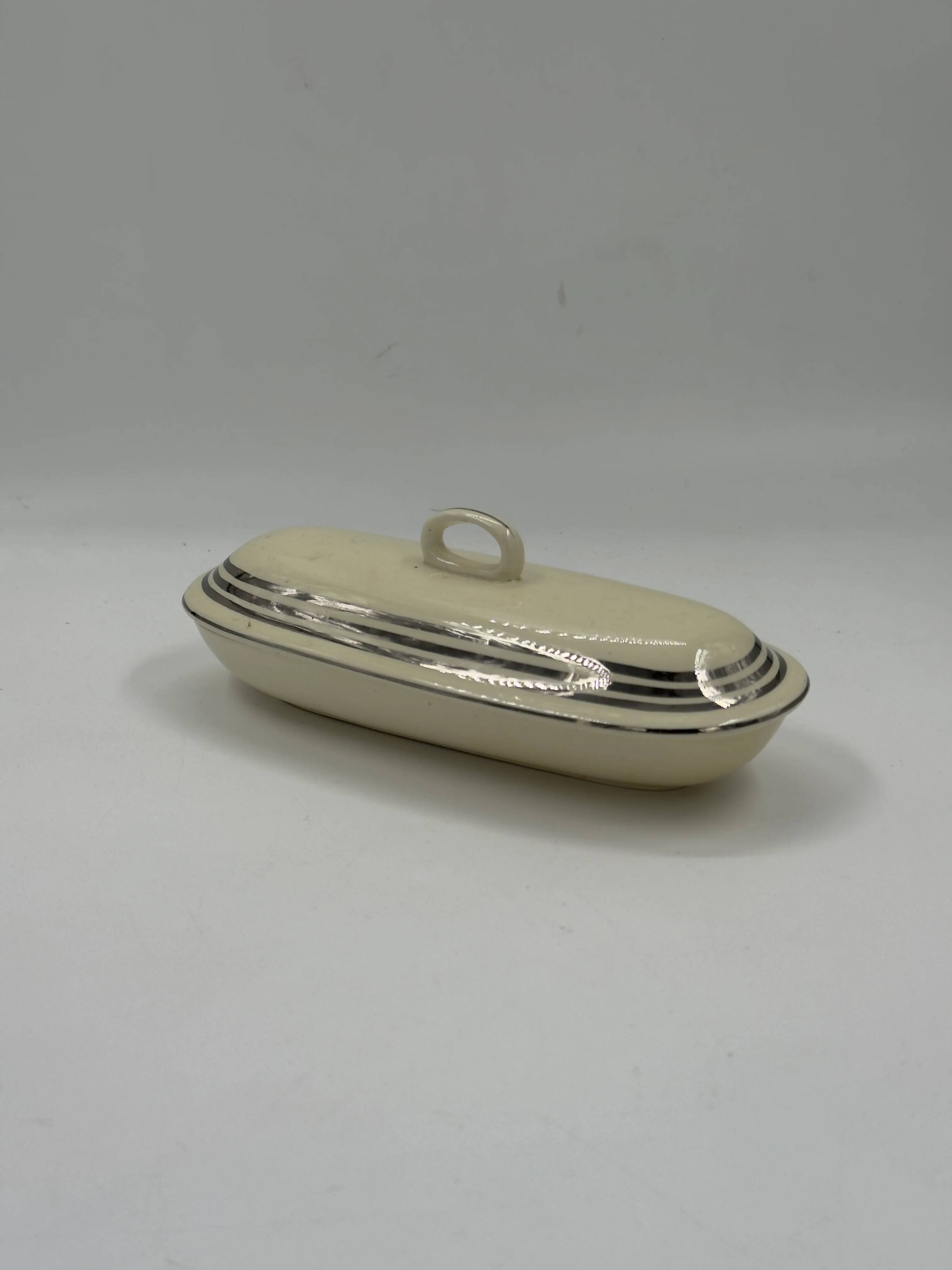 Vintage Art Deco butter dish in ivory ceramic with platinum stripes.