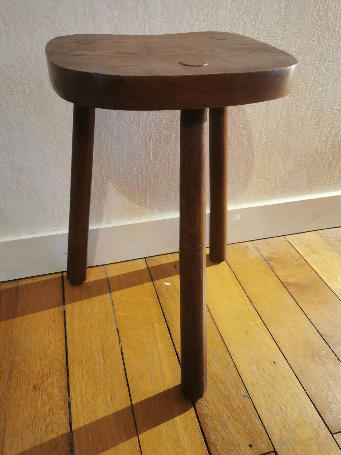 Old wooden tripod bench stool milking shepherd’s bench