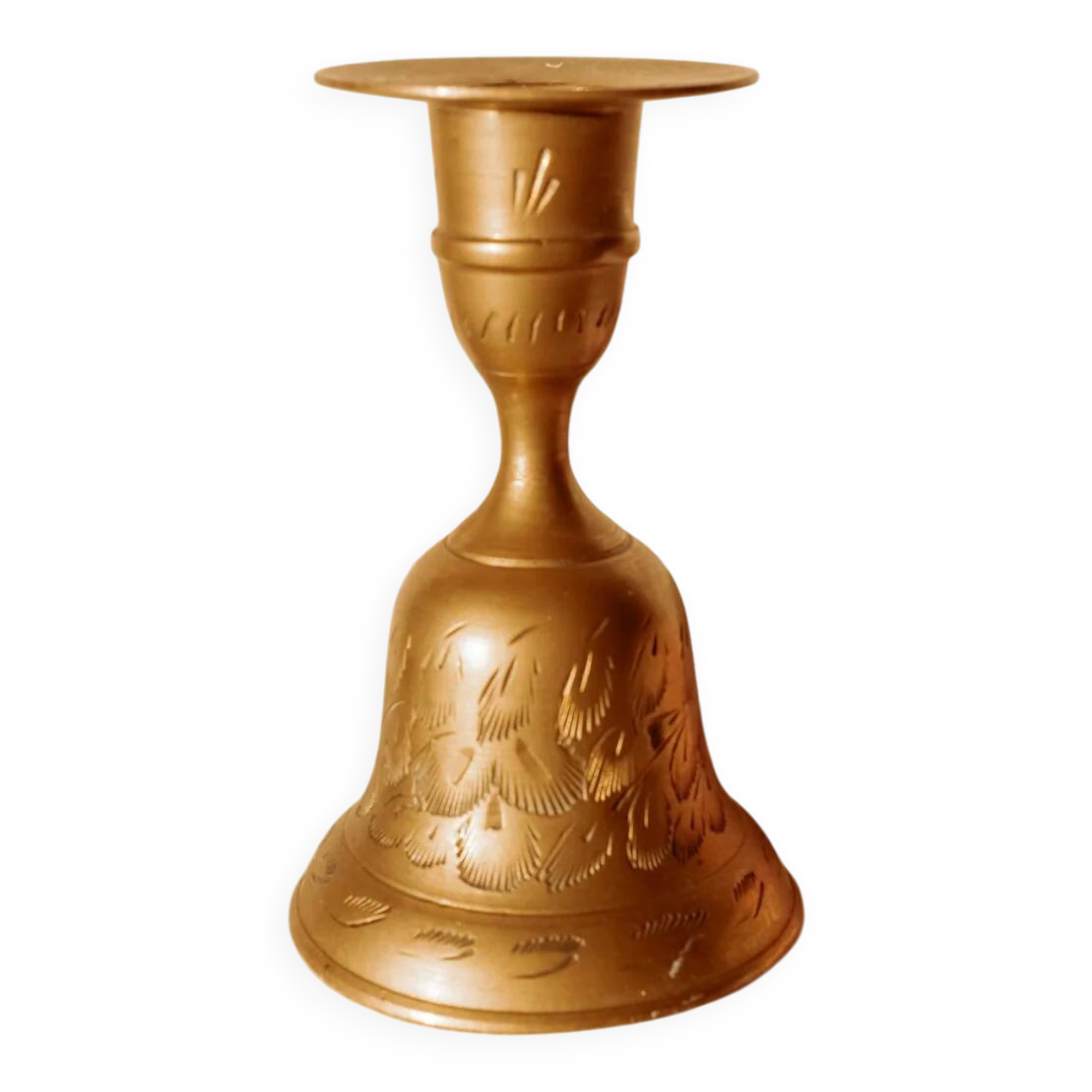 Brass candlestick in the shape of a bell.