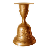 Brass candlestick in the shape of a bell.