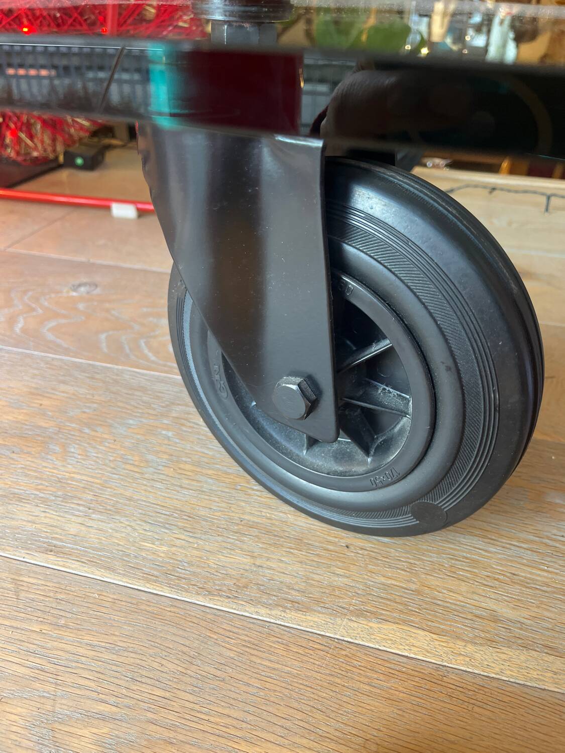 Gae Aulenti coffee table for Fontana Arte, transparent glass top with black cast iron supports, 1980s.