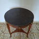 Empire guéridon table in mahogany with a black marble top and gilded bronze.