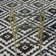 Nested table in gold metal and glass