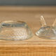 Pair of "chicken" salerons made of molded glass