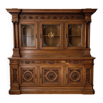 Two-body buffet, made of richly carved solid walnut.