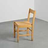 Set of six solid pine chairs by Maison Regain.