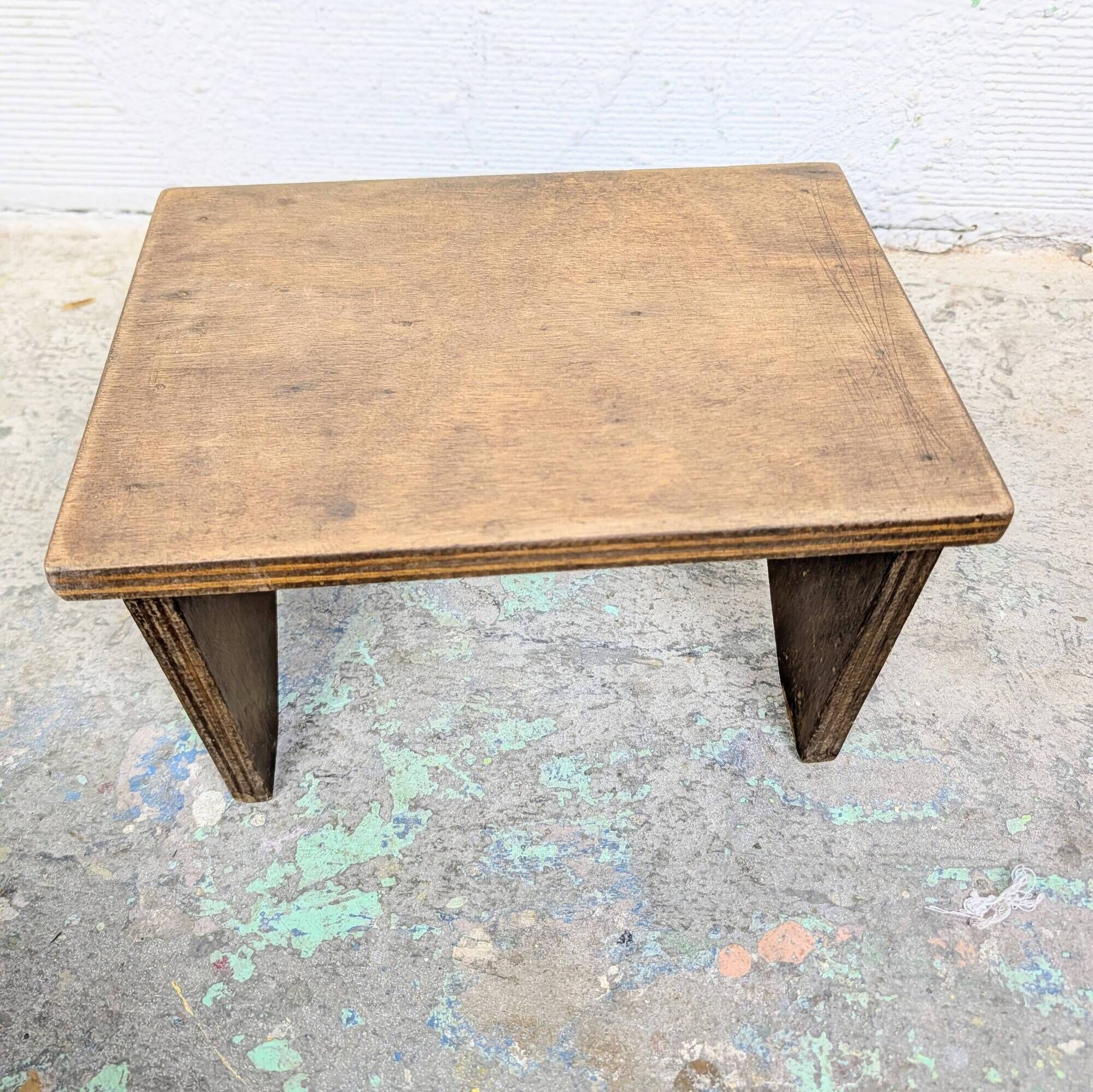 Small patinated wooden footrest bench