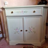 Wooden sideboard with floral patterns