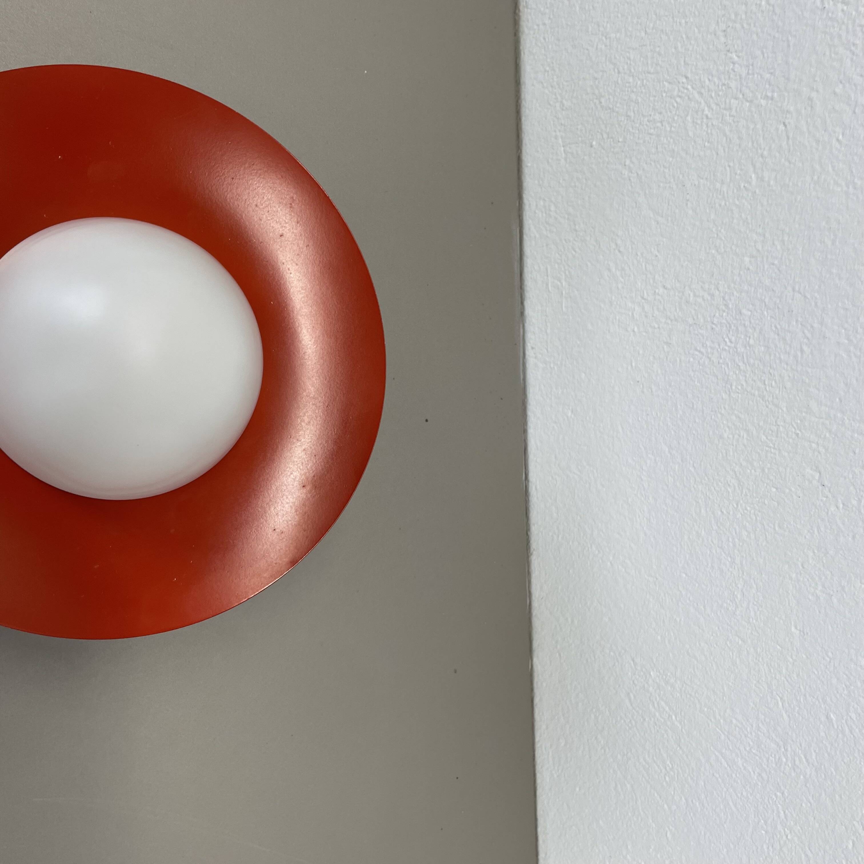 Round red wall light in metal and opaline glass in the Stilnovo style, 20 cm, Italy, 1960s