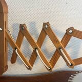 Accordion wood wall light with wavy opaline