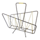 Black metal magazine rack with yellow scoubidou wire.