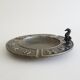 Luxa brass ashtray with zodiac relief and embers killer