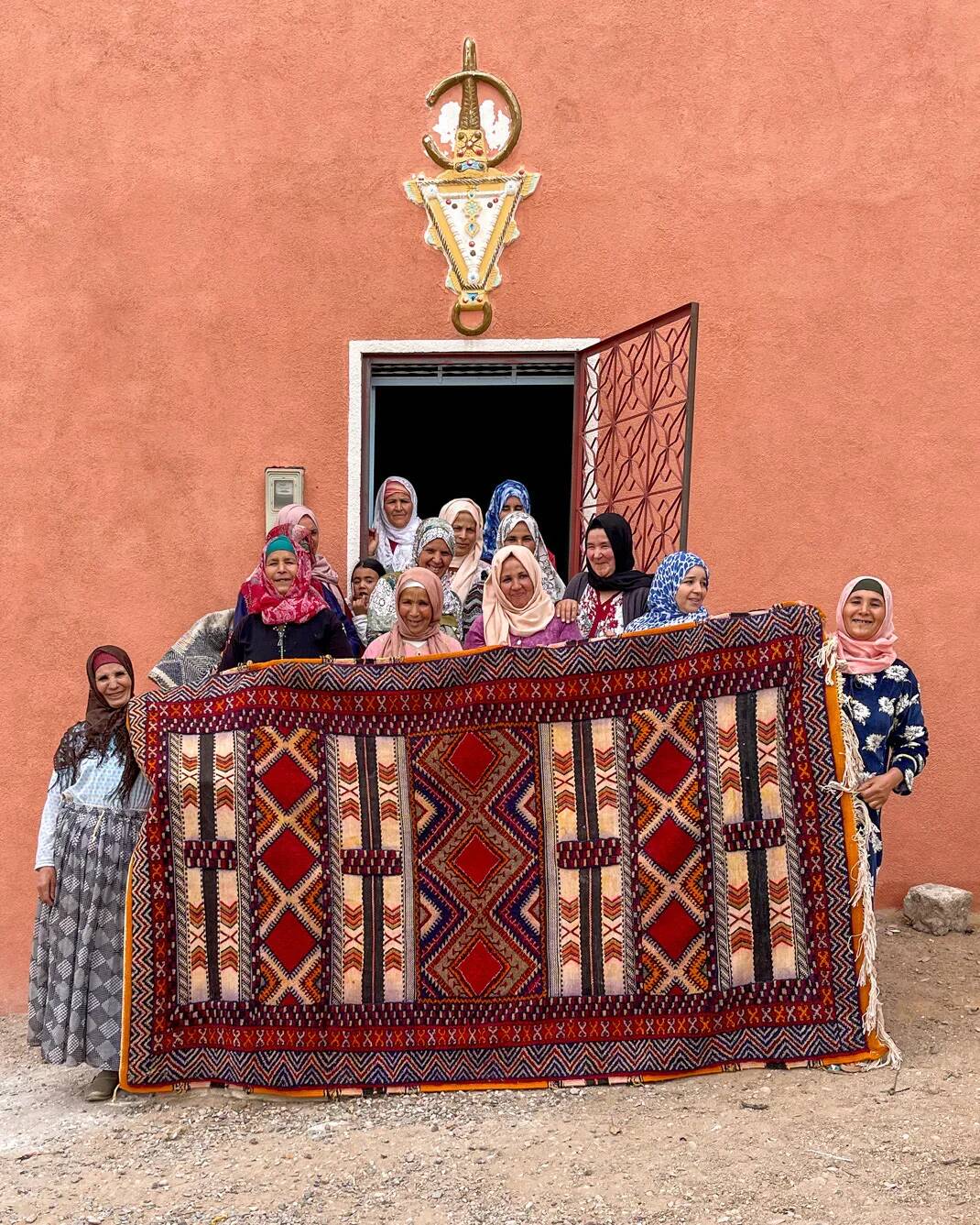 Hand-knotted low pile rug in vibrant earth tones by Anzal | 152 x 264 cm