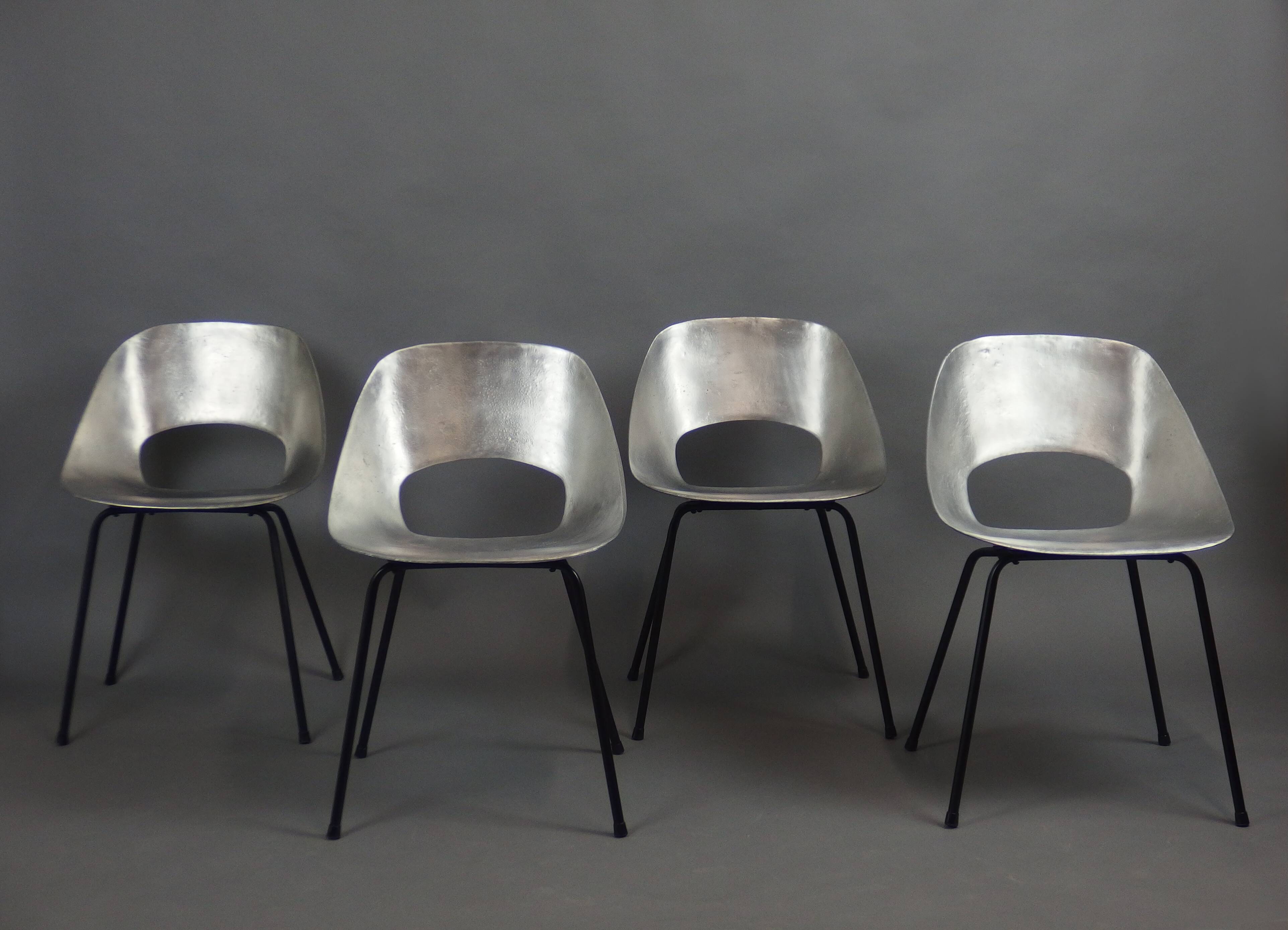 Four aluminium chairs by Pierre Guariche