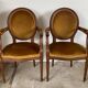Paire de fauteuils médaillon en bois et velours