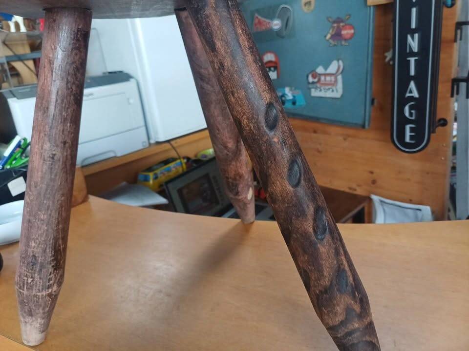 Vintage tripod stool in carved solid wood.