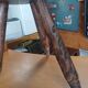 Vintage tripod stool in carved solid wood.