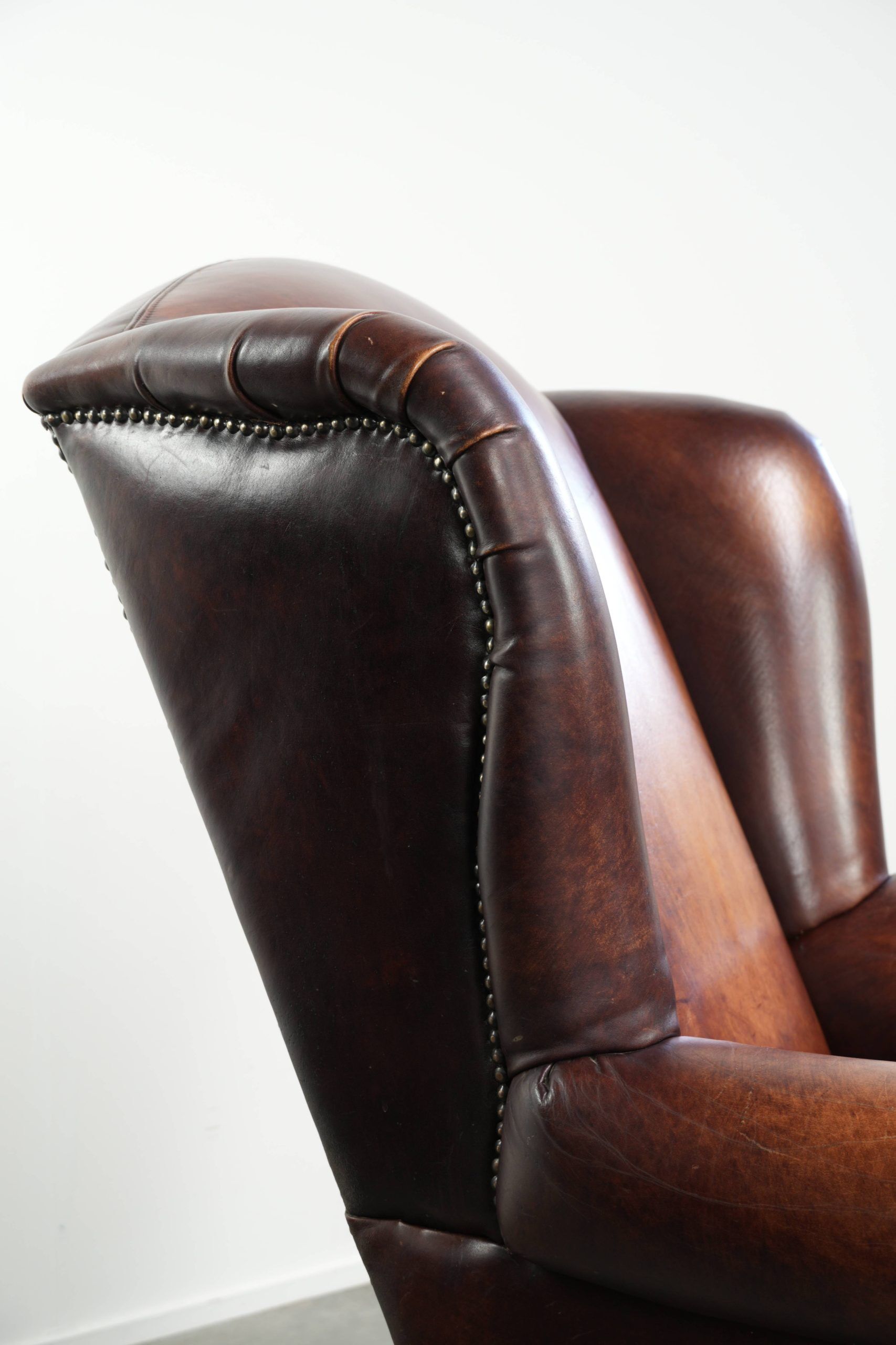 Comfortable cowhide wingback armchair in English style
