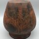 Vase or pot in brown terracotta with artistic decoration of fish.