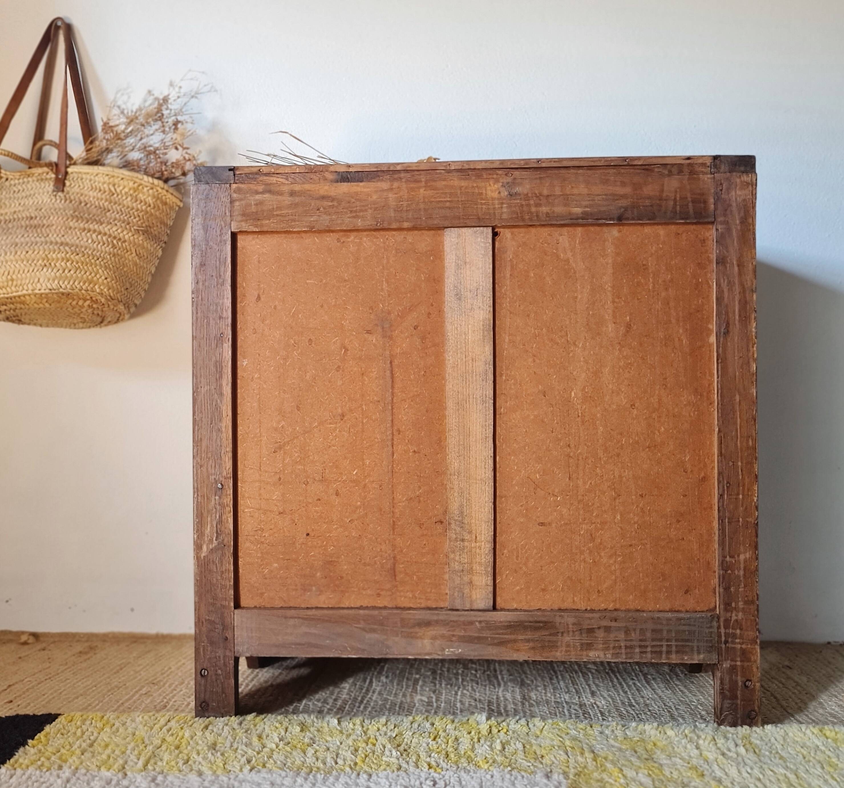 Art Deco chest of drawers in raw oak with carved drawers.