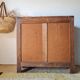 Art Deco chest of drawers in raw oak with carved drawers.