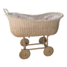 Vintage white rattan rolling cradle